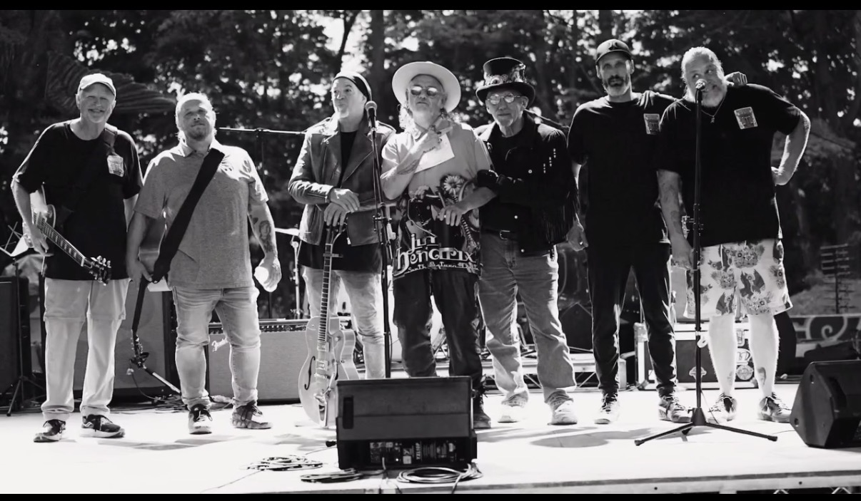 Black-and-white portrait of Fast Eddie and the Sweater Cats on stage